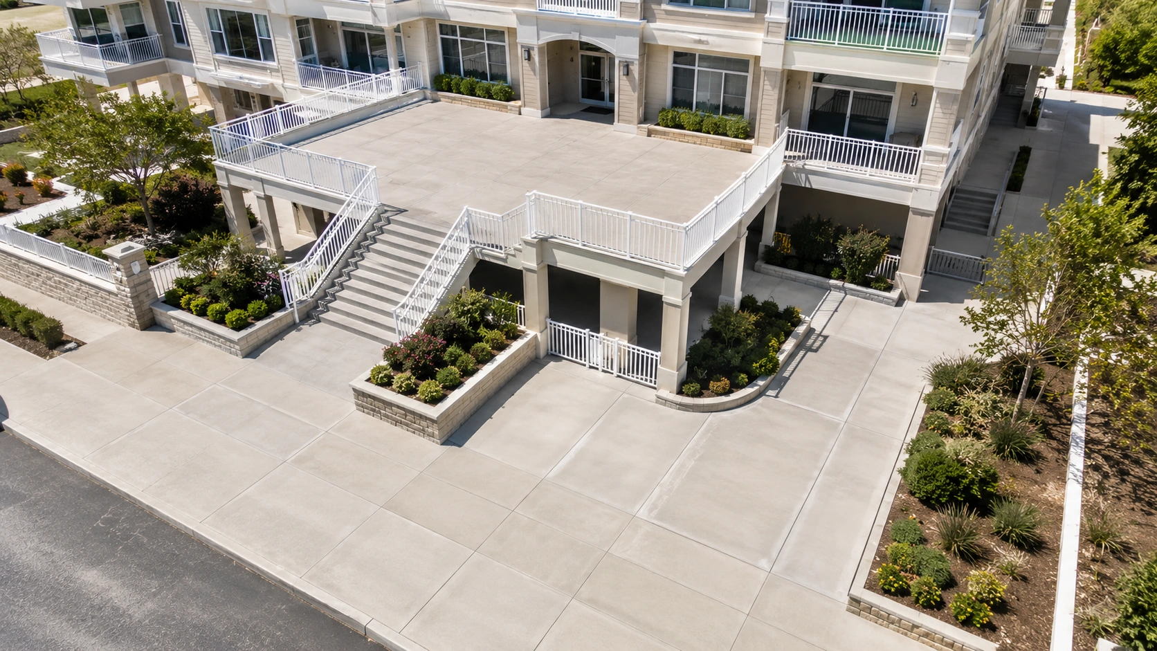 Concrete walkways, stairs, walls, and transitions at a multi-family property